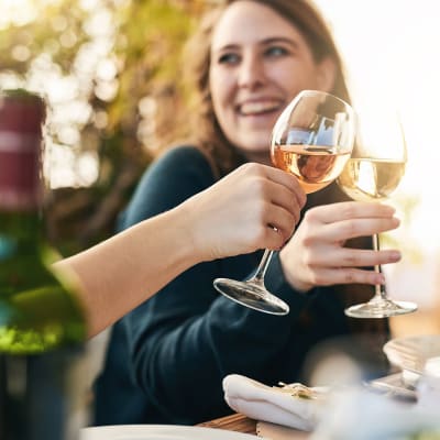 Residents toasting with some wine near Champions Vue Apartments in Davenport, Florida