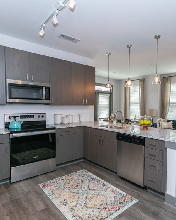 Kitchen with modern appliances at Gibson Flowery Branch | Apartments in Flowery Branch, Georgia