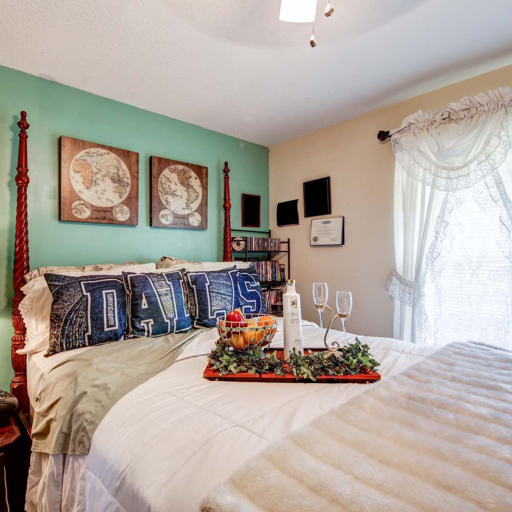 Comfy bed in a bedroom of an apartment at Oak Hollow in Summerville, South Carolina