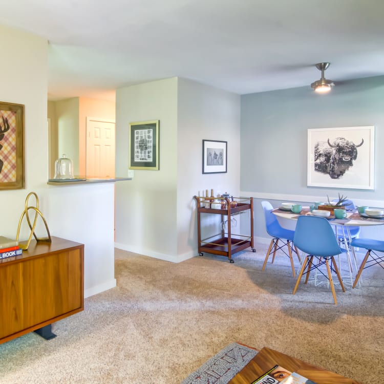 Plush carpeting and retro-modern furnishings in a model home's living area at Sofi at Murrayhill in Beaverton, Oregon