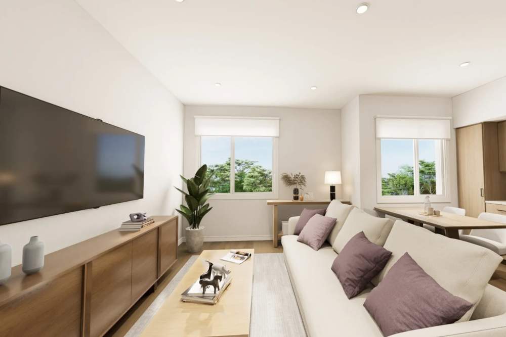 Living room with sofa and television at The Acacia in Palo Alto, California