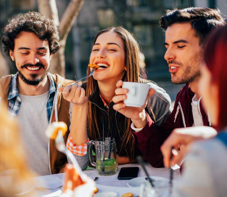 A group of friends enjoying their lunch at nearby restaurant at Flatiron District at Austin Ranch, The Colony, Texas