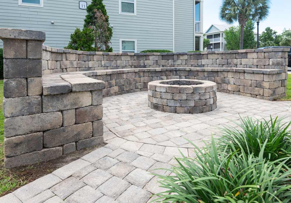 Community firepit with seating at The Crossings At Nine Mile Road in Pensacola, Florida