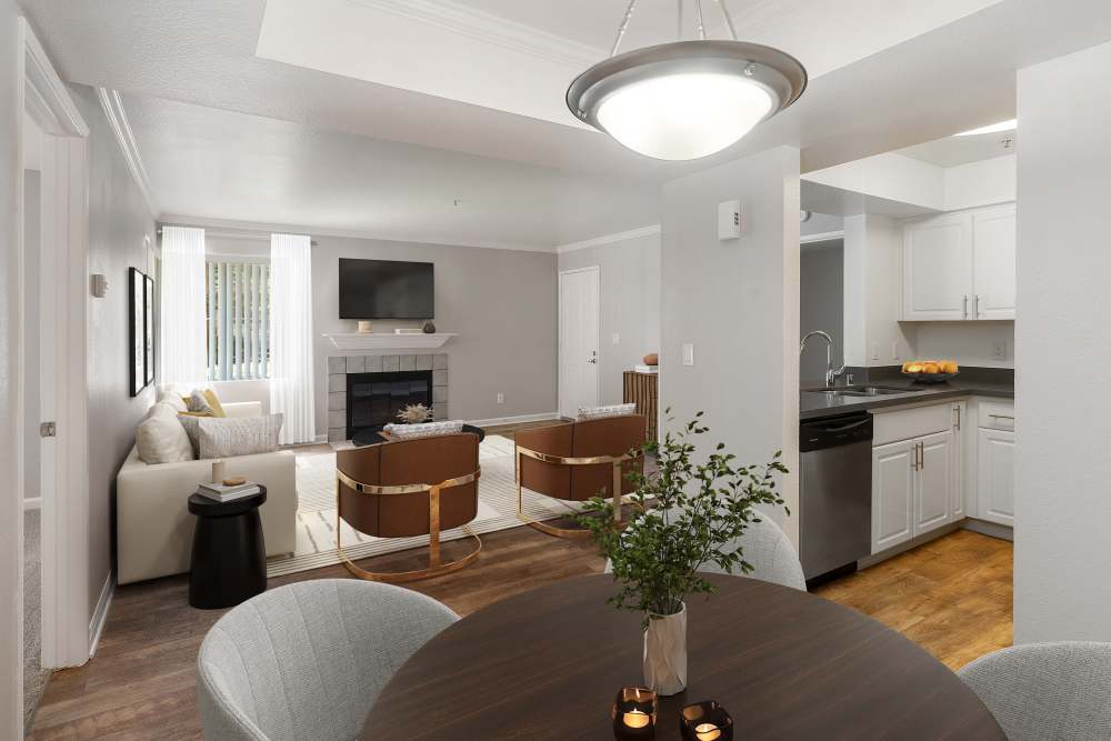 A spacious living room with wood-style flooring at Mill Springs Park Apartment Homes in Livermore, California