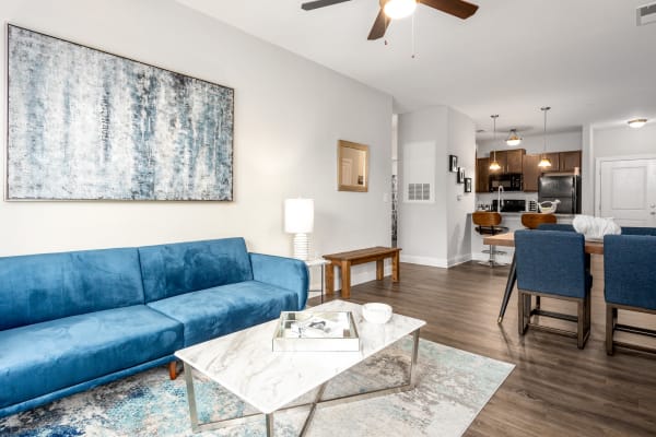 A furnished apartment living room and dining room at Retreat at the Park in Burlington, North Carolina