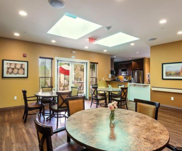 Dining area and kitchen at Healdsburg, A Pacifica Senior Living Community in Healdsburg, California