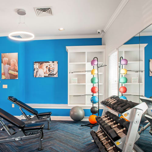 Cardio machines and weights in the high-tech fitness center at Montgomery Manor Apartments & Townhomes in Hatfield, Pennsylvania