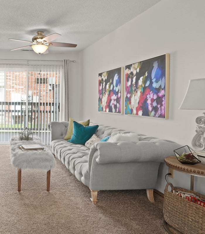 Spacious carpeted living room at Huntington Park Apartments in Wichita, Kansas