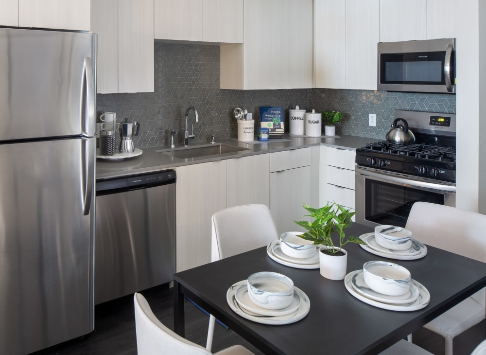 a fully equipped kitchen in an apartment at SoLa Apartments in Los Angeles, California