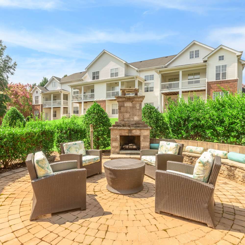 Outdoor lounge area with fireplace Camellia in Raleigh, North Carolina 
