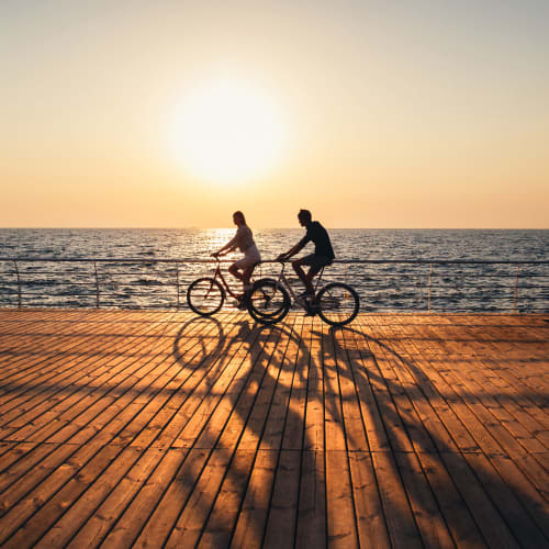 Residents riding bicycles on a near Navy Submarine Base Pt. Loma in San Diego, California