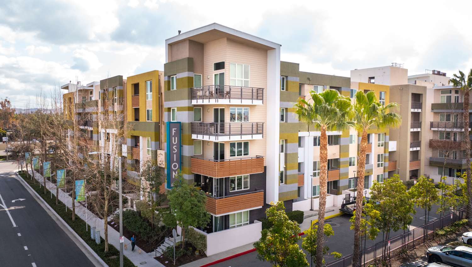 Palm trees outside resident buildings at Fusion Apartments in Irvine, California