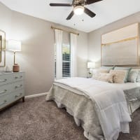 A furnished model apartment bedroom at Chace Lake Villas in Birmingham, Alabama