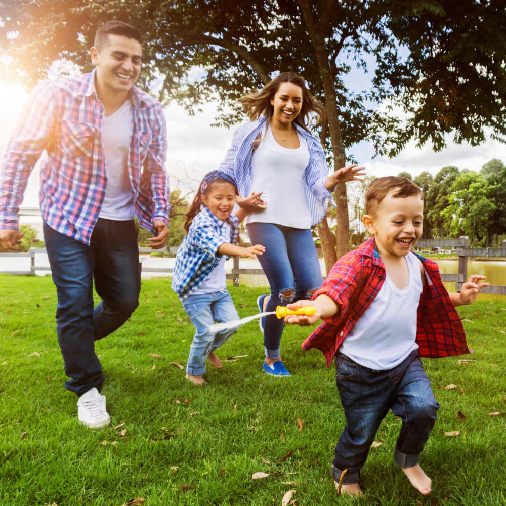 Resident family having fun in a park near at Oaks Pentagon Village in Edina, Minnesota