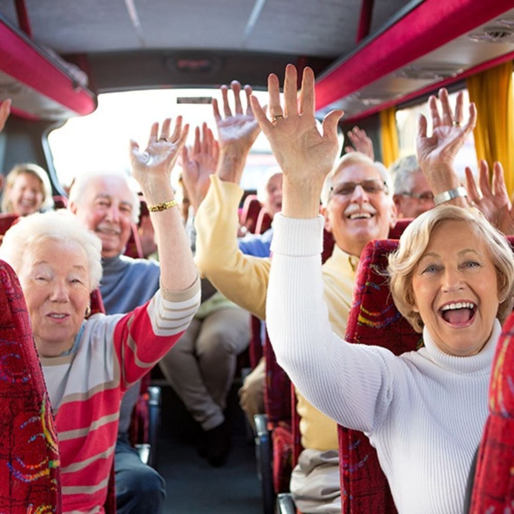 Happy residents on the bus at Regency Newcastle in Newcastle, Washington
