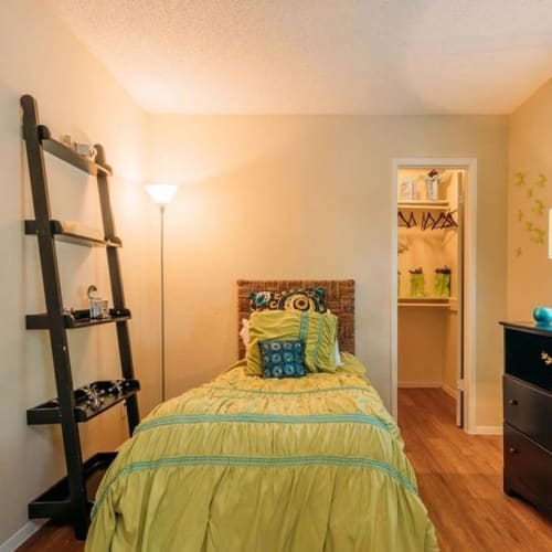 Model bedroom with hardwood floors at Park Vista Apartments in San Antonio, Texas