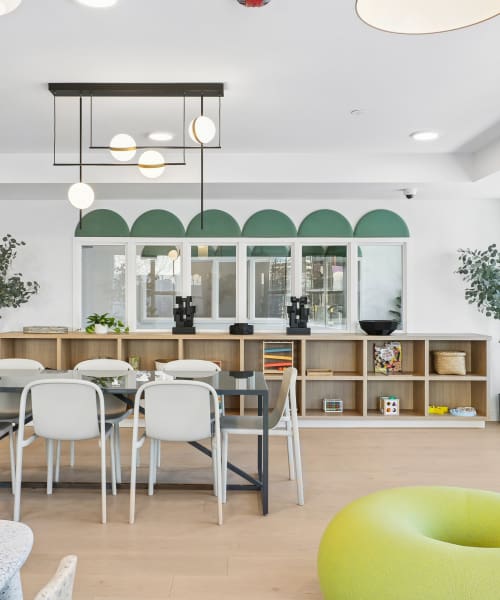 Community kitchen with dining table and chair Mily on Green in Philadelphia, Pennsylvania