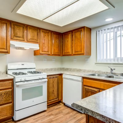 A kitchen with appliances in a home at Carl Vinson Park in Lemoore, California