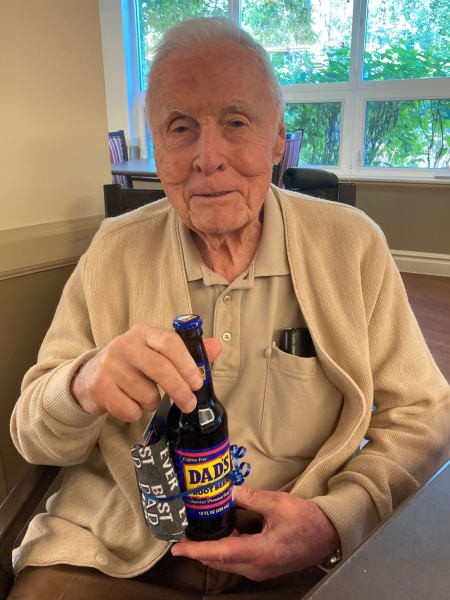 A Cottonwood Heights (UT) resident poses with his bottle of Dad's Root Beer.