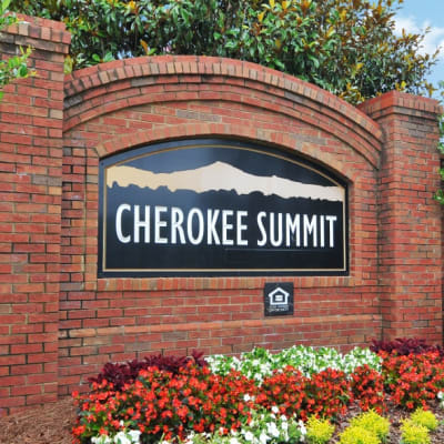 Exterior sign in front of the apartments at Cherokee Summit Apartments in Acworth, Georgia