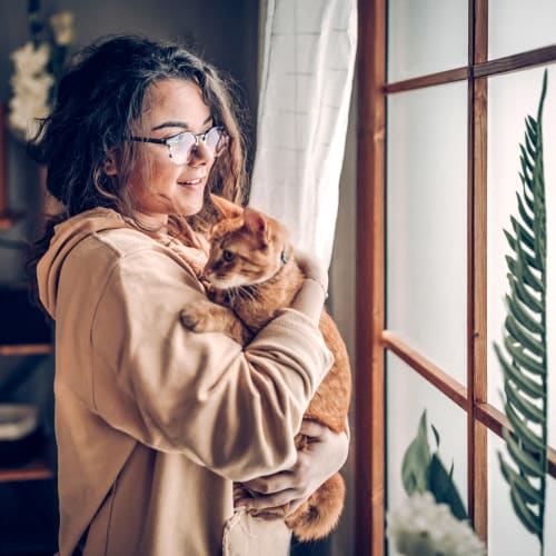 A resident holding her cat at Covenant Trace in Newport News, Virginia