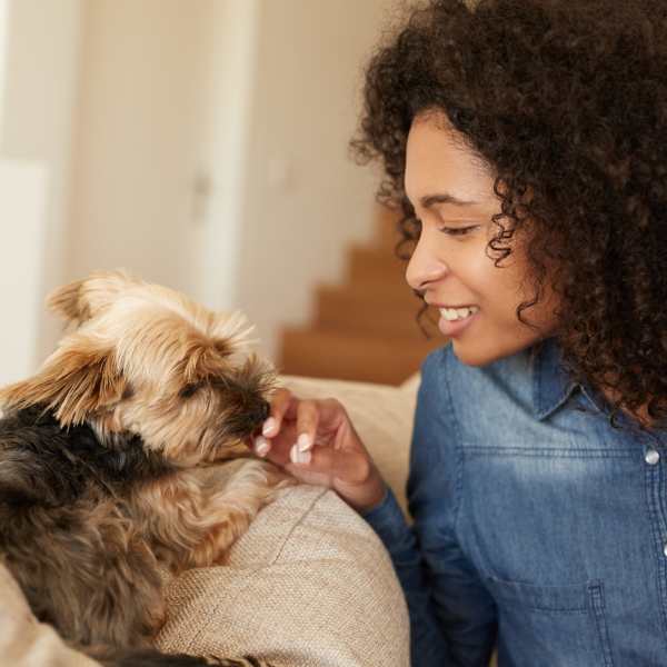 A resident sits with her puppy at The Encore, Alexandria, Virginia