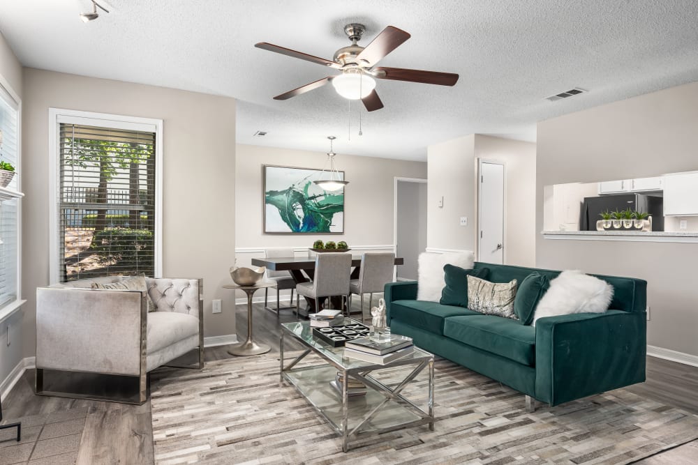 A furnished apartment living room and dining room at Renaissance at Galleria in Hoover, Alabama