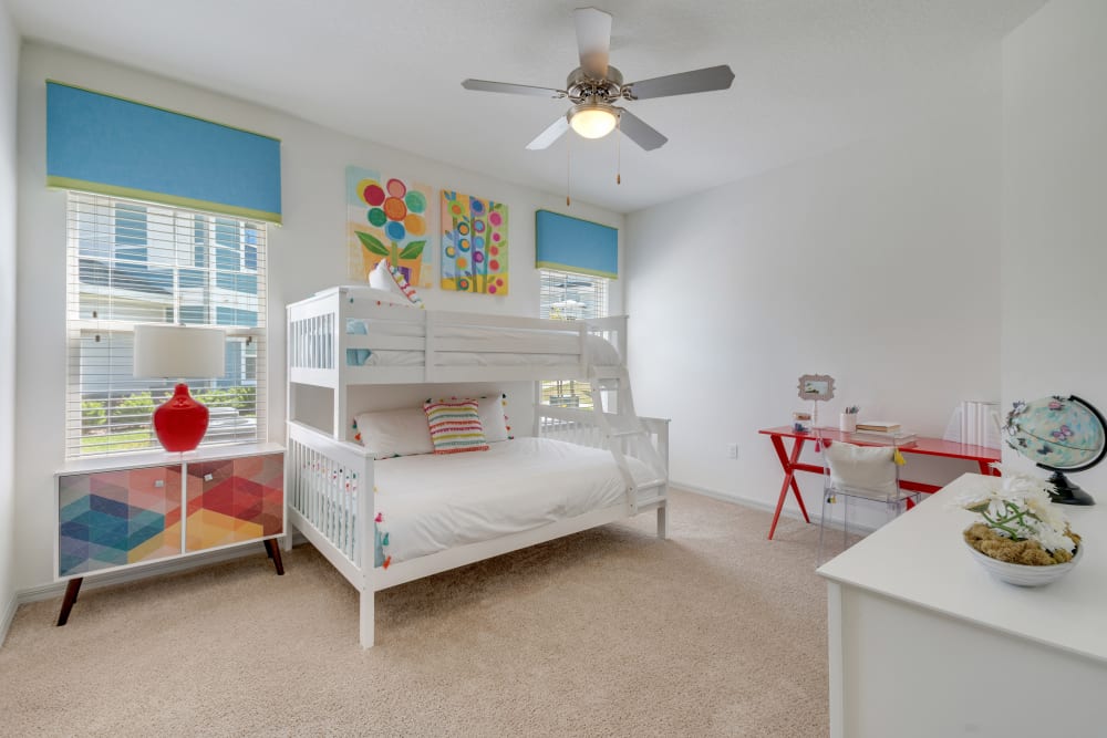 Brightly furnished model bedroom for children at Champions Vue Apartments in Davenport, Florida