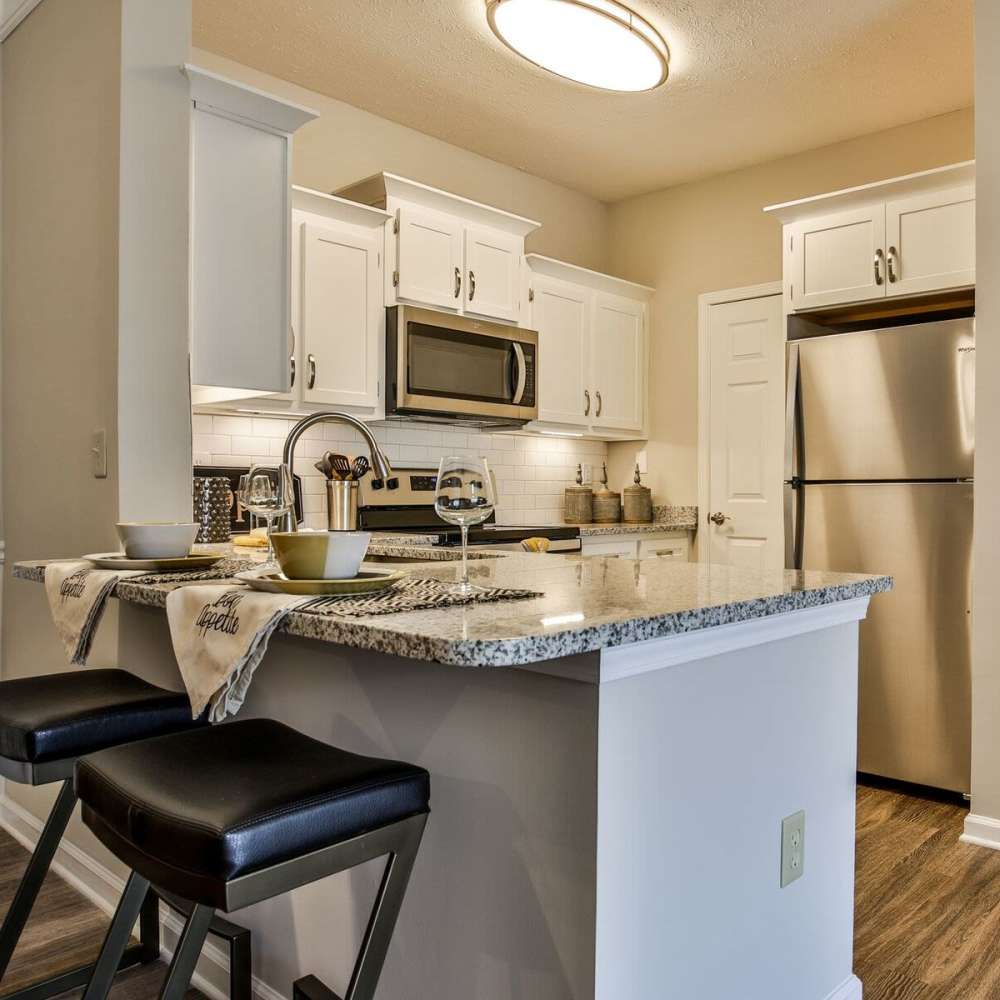 Kitchen with barstools at Avonlea Highlands in Cartersville, Georgia