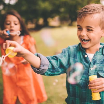 Children blowing bubbles at Clarkdale in Joint Base Lewis McChord, Washington