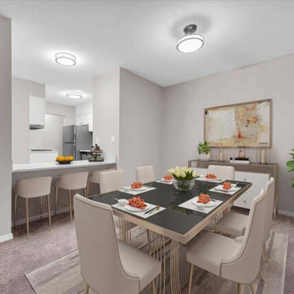 Open dining space with a kitchen island, bar seating at Woodbrook in Gardendale, Alabama