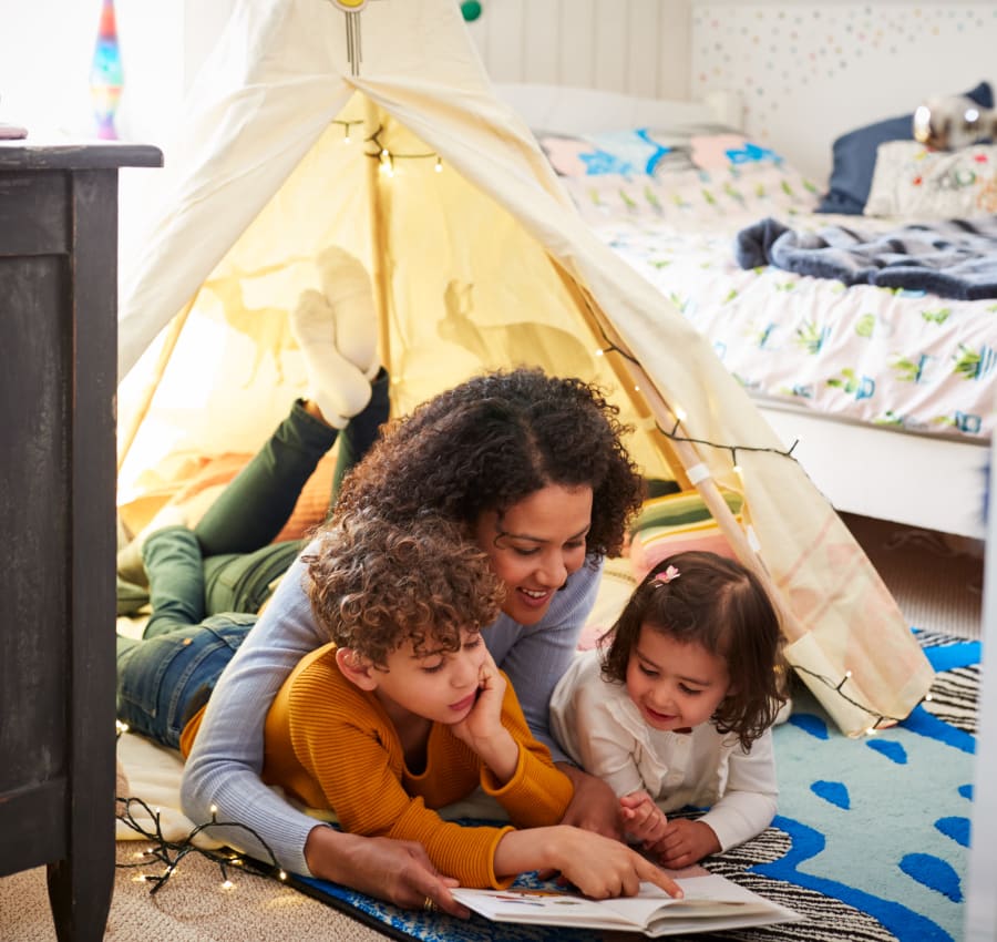 Resident reading to her children at Exeter Place in San Antonio, Texas