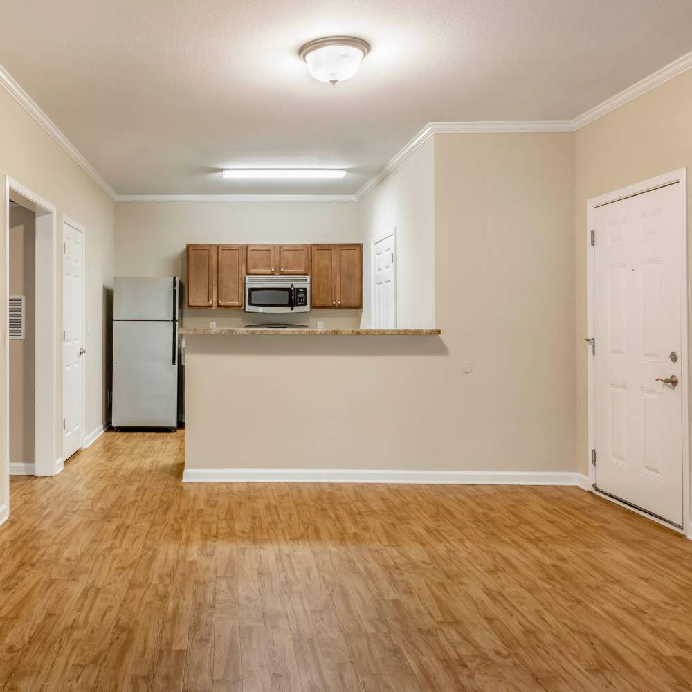 Dining area with wood-style flooring at Chenal Pointe at the Divide in Little Rock, Arkansas
