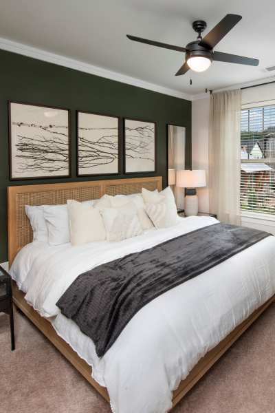 Cozy bedroom with a nice ceiling fan and window at Timberline View in Buford, Georgia