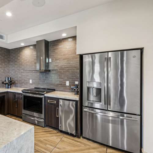 View of the kitchen from the spacious living room at Portrait At Hance Park in Phoenix, Arizona
