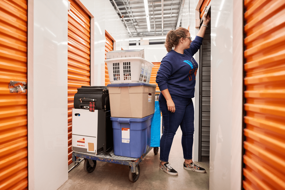A customer moving items into their unit at BuxBear Storage Tulsa in Tulsa, Oklahoma