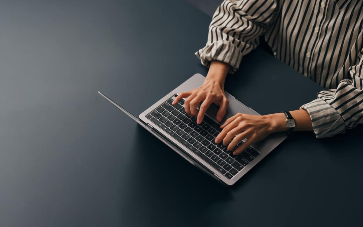 Resident working with laptop at The Rosewood Apartments in Vancouver, Washington