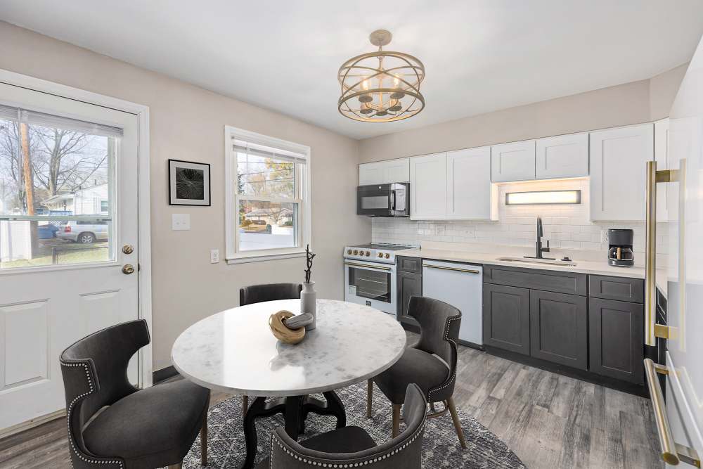 Kitchen and dining area in the apartment at Eden Green Townhomes in Columbus, Ohio