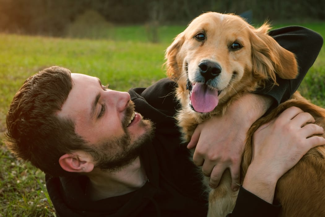 Resident playing with his lovely dog at Waterside Apartments in Graham, North Carolina