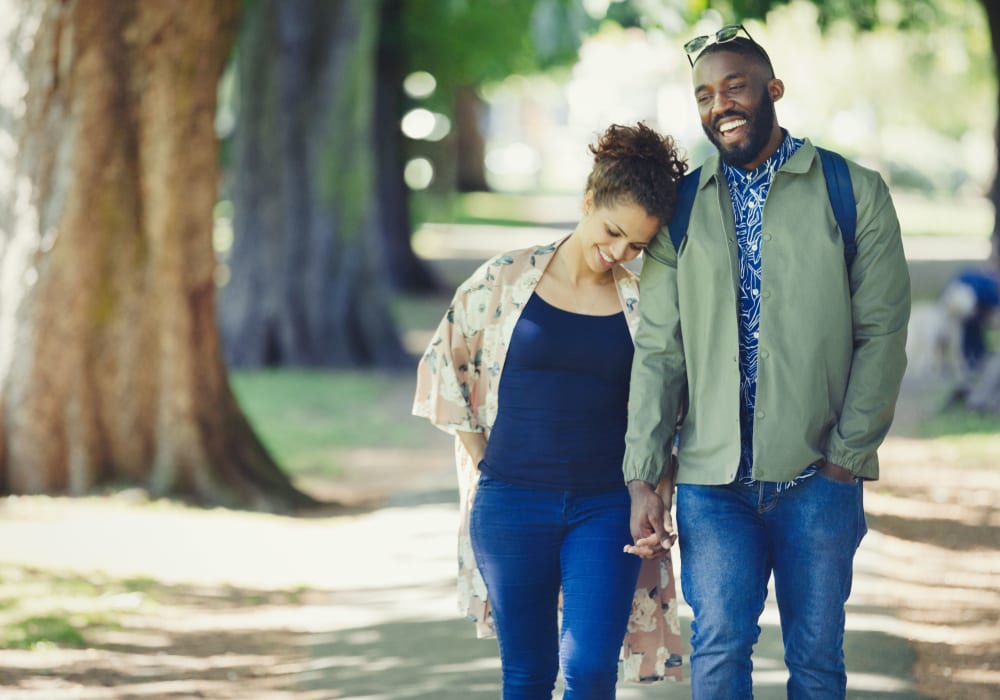 Couple walking around in Garland, Texas near 5th Street Crossing City Center