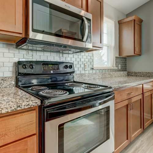 Kitchen with stainless steel appliances at Webster Green in Webster, New York