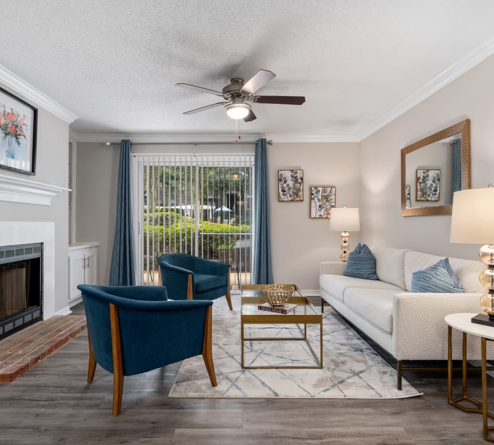 A spacious living room with a fireplace at Regency Gates in Mobile, Alabama