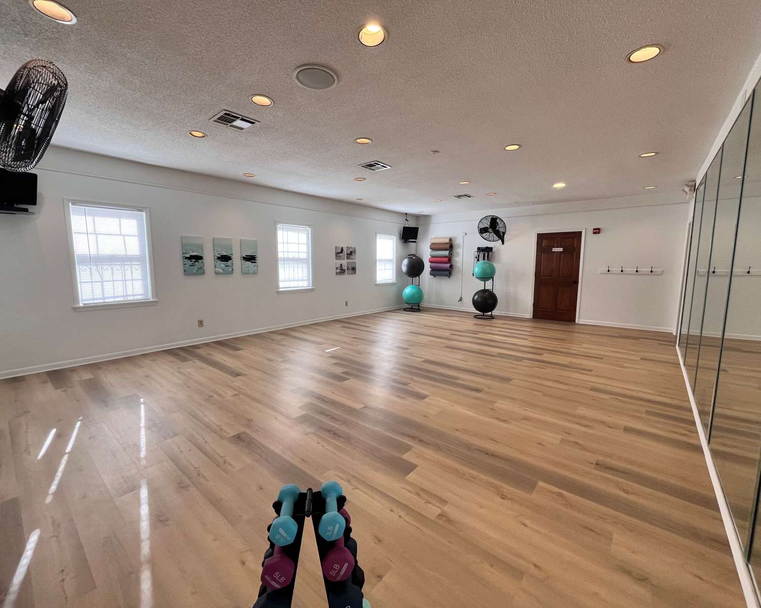 Yoga room with wood-style flooring at Georgetown Apartments in Merriam, Kansas