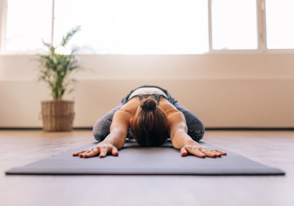 Resident doing some yoga in the fitness center at Sofi Union City in Union City, California