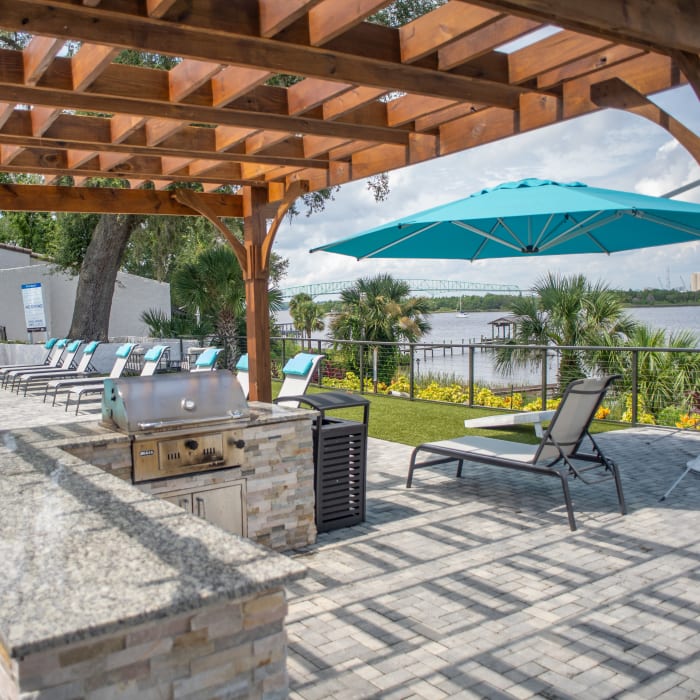 Grilling area alongside the sparkling St Johns River at Pier 5350 in Jacksonville, Florida