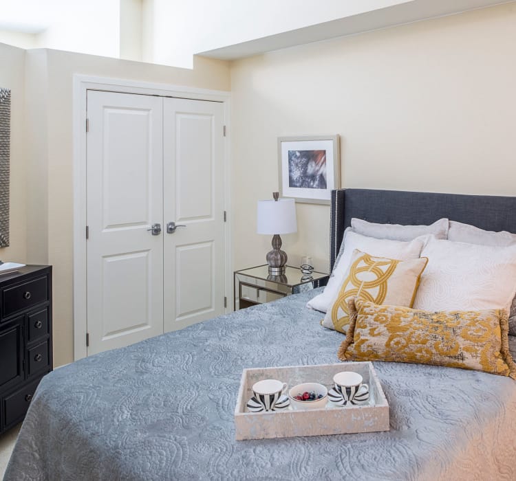 Well-appointed assisted living bedroom at Village at Belmar