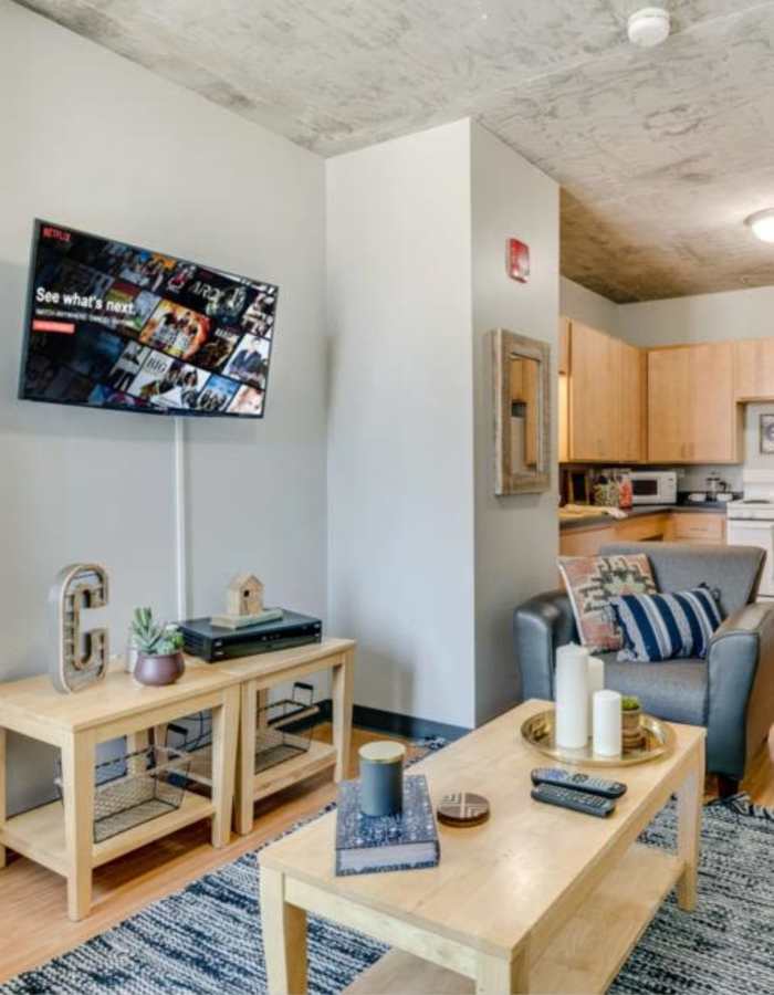 Living and kitchen view at The Flats at East West University in Chicago, Illinois