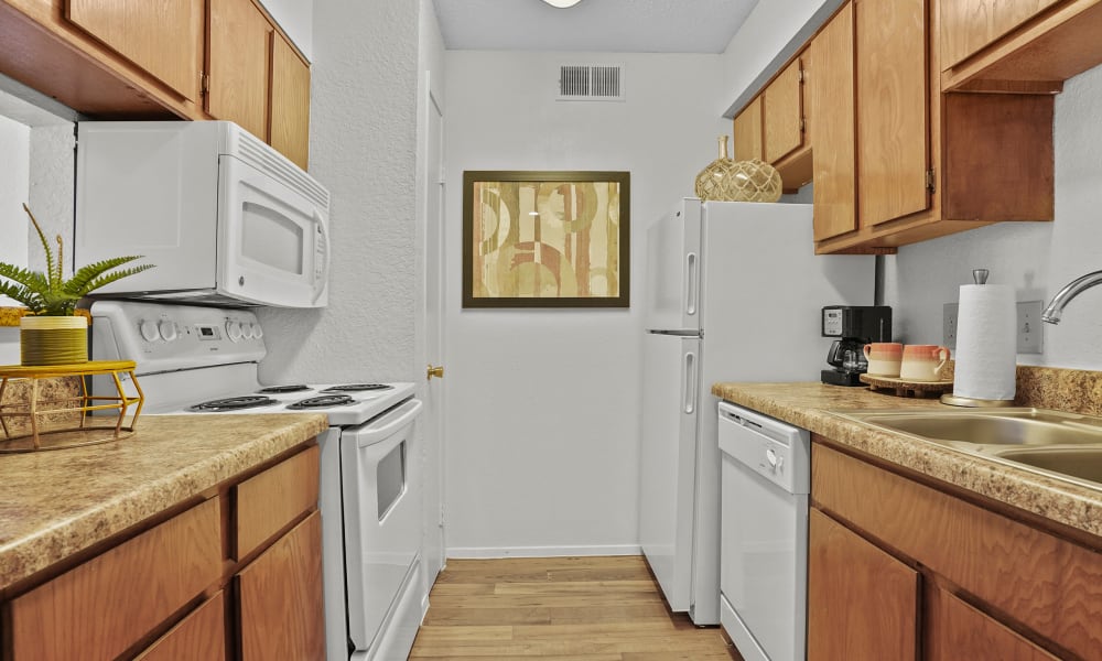 Bright and fully equipped kitchen at Windsail Apartments in Tulsa, Oklahoma
