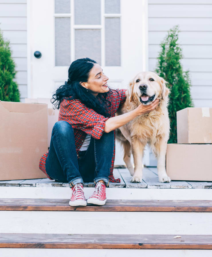 A woman and her golden retriever take a break from packing near 101 Storage in Valley Village, California