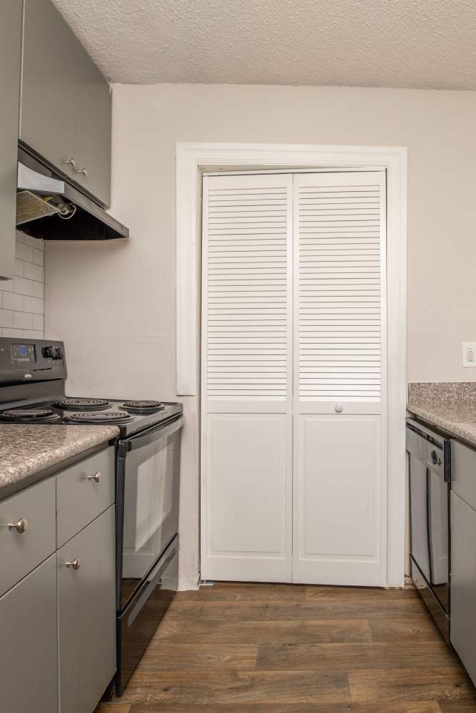 Apartment kitchen at Fredericksburg Place Apartments in San Antonio, Texas